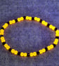 UV Reactive Orange Glass Bead and Black Glass Bicone Elastic Bracelet - Image 4