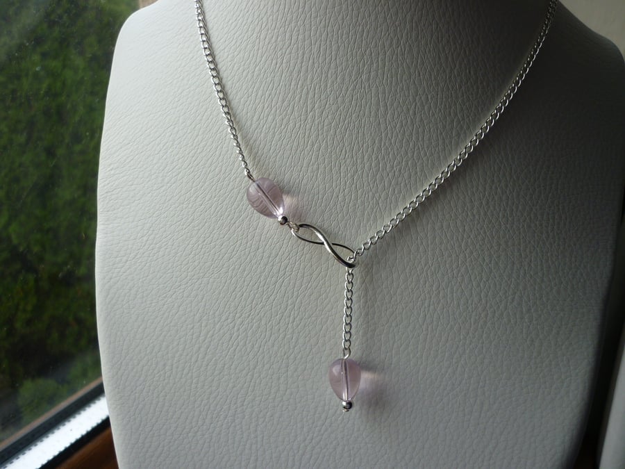PINK AND SILVER, INFINITY LARIAT DESIGN NECKLACE.