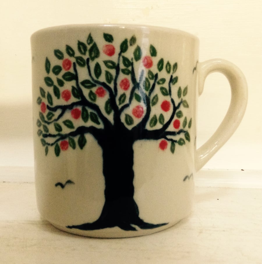 Mug in pottery stoneware with apple tree design. 