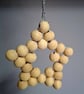Rustic star decoration made with wooden beads