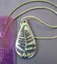 Metallic green and bronze fern tear-drop pendant on a green woven cord. - Image 4