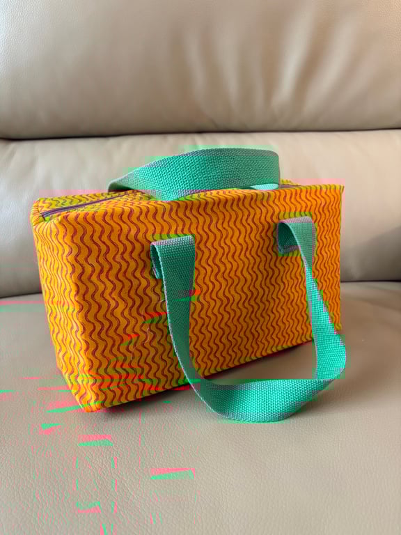 Orange and green make up bag with handles