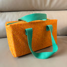 Orange and green make up bag with handles