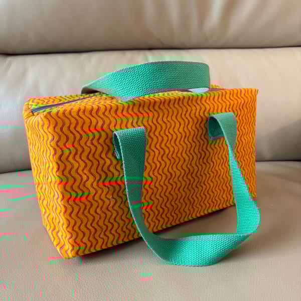 Orange and green make up bag with handles