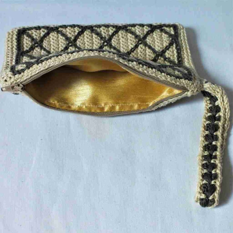 Crocheted clutch - cream and olive green with gold lining.