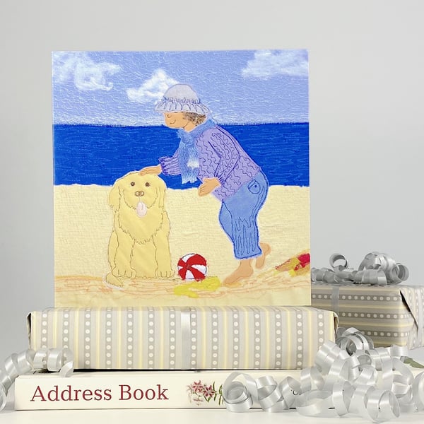 Birthday card with dog on beach by seaside