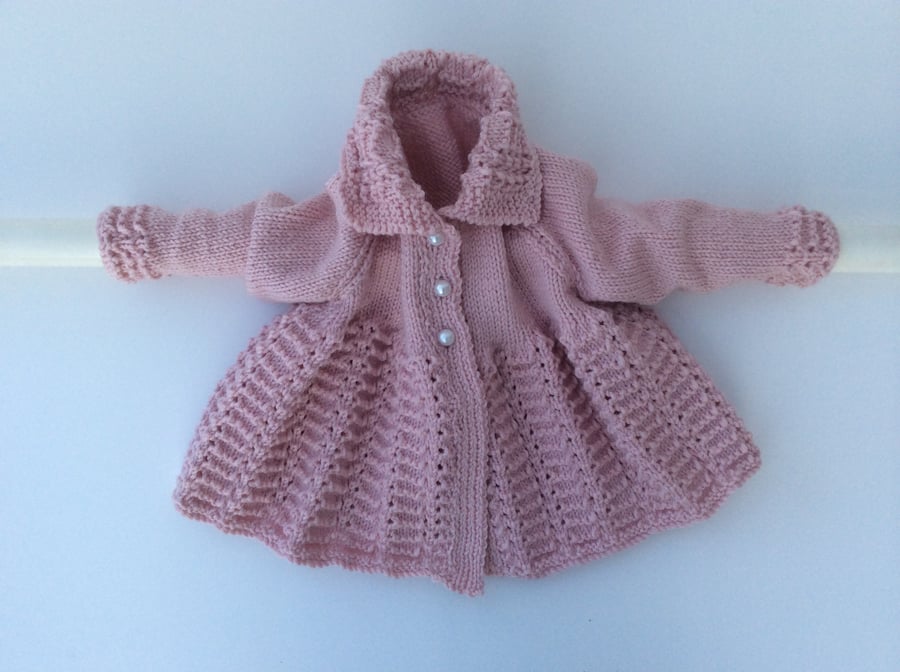 Hand knitted matinee coat in merino wool