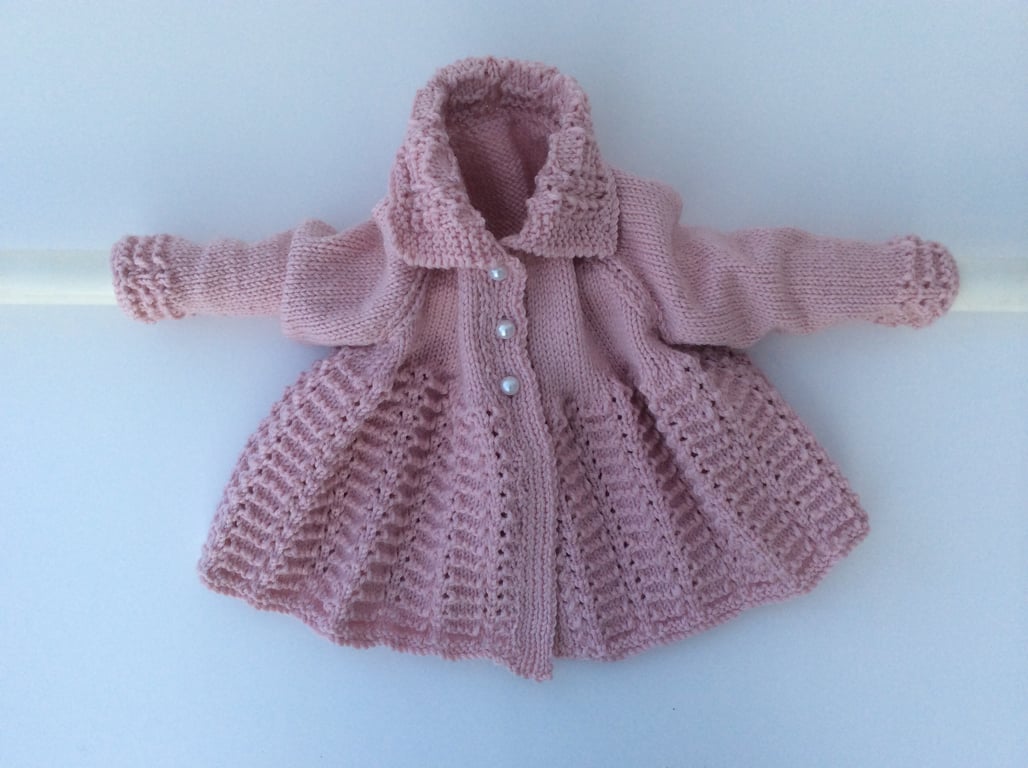 Hand knitted matinee coat in merino wool