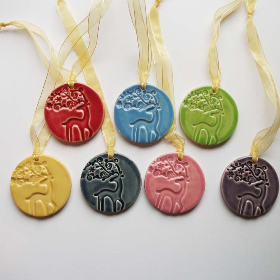Set of seven ceramic stag Christmas decorations bright pottery