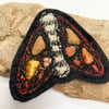 Upcycled moth brooch pin or badge. 