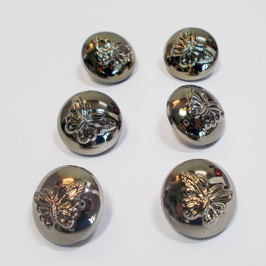 Gunmetal, butterfly dome shank buttons 22mm approximately. Pack of 6