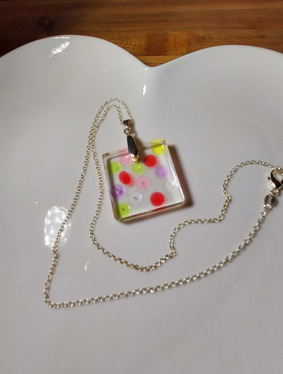 Multicoloured resin pendant necklace on a silver plated chain