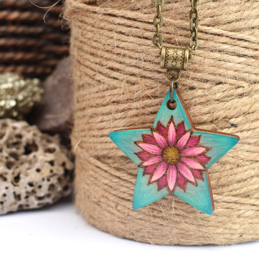 Pink flower on mint green pyrography pendant. Floral star necklace.