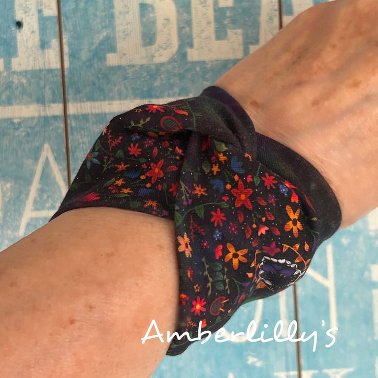 Cuff bracelet with a floral theme