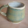  Stoneware pottery mug finished in a sage green glaze