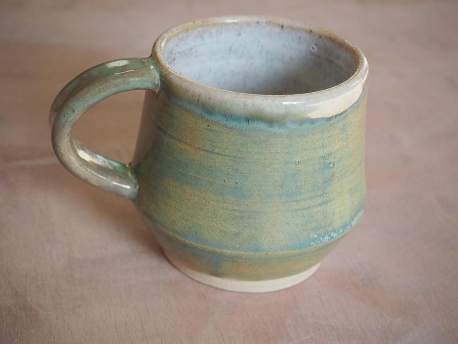  Stoneware pottery mug finished in a sage green glaze