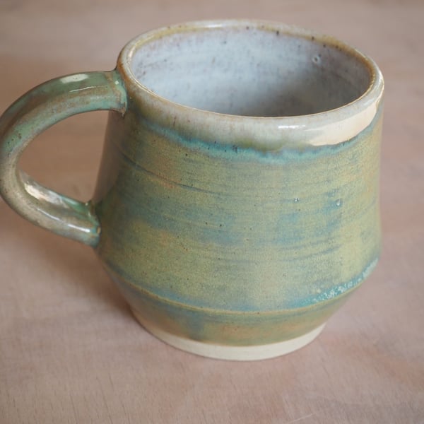  Stoneware pottery mug finished in a sage green glaze