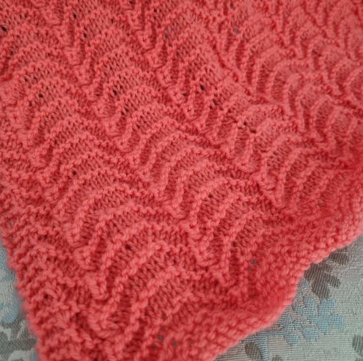 Hand knitted coral baby blanket, crib, pram bla... Folksy
