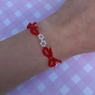 Red Bow Flower Seed Bead Bracelet