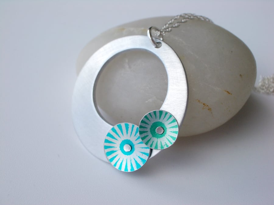 Circle pendant necklace in brushed aluminium with green and blue discs