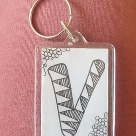 Hand drawn initial "V" keyring.