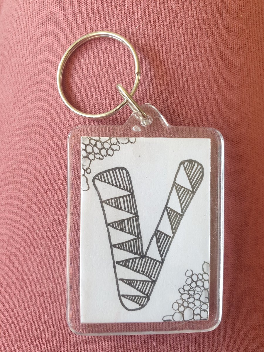 Hand drawn initial "V" keyring.