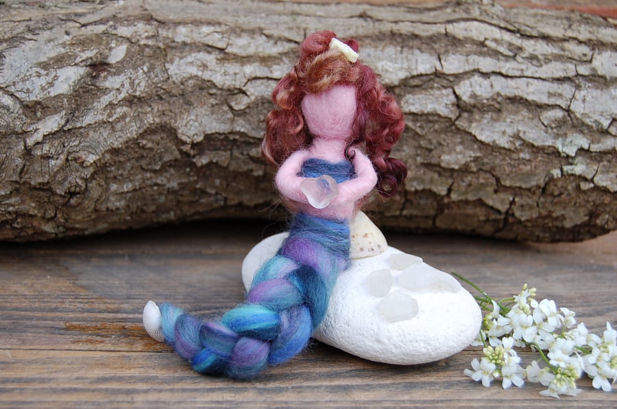 Needle felt Mermaid holding sea glass heart reclining on a shell - plaited tail