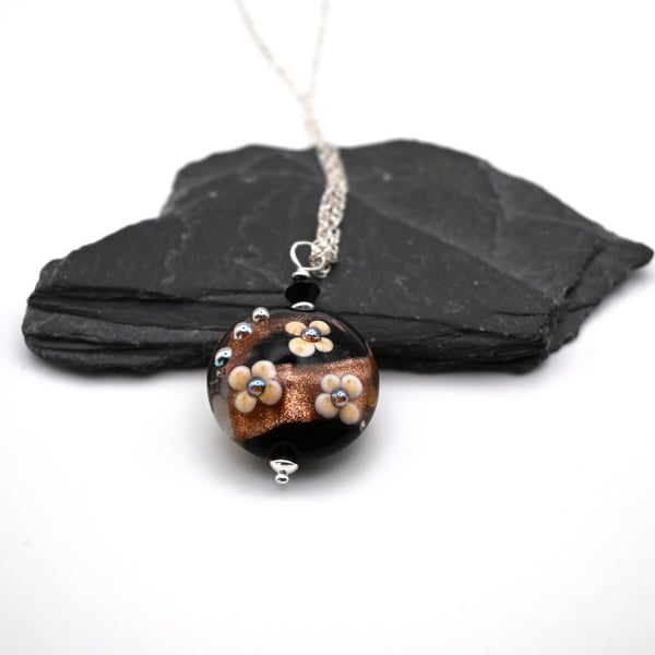 lampwork glass black and goldstone flower pendant necklace
