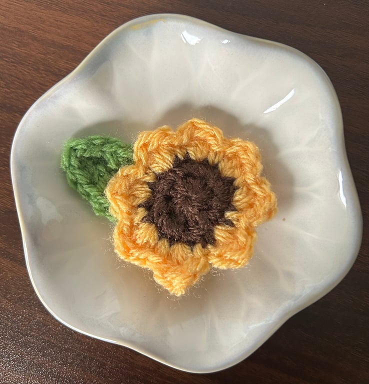 Crocheted small sunflower brooch 