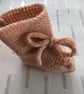 Hand knitted peach coloured bootees - Image 4
