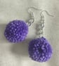 Purple pom-pom earrings