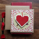 Red Christmas decoration with robin card