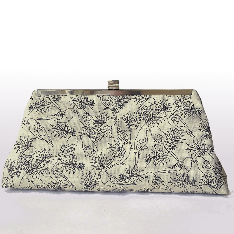Smart clutch bag with pencil style images of birds, kiss-lock silver tone frame