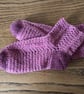 A pair of red crochet recycled wool blend women's ankle socks in UK size 5-6