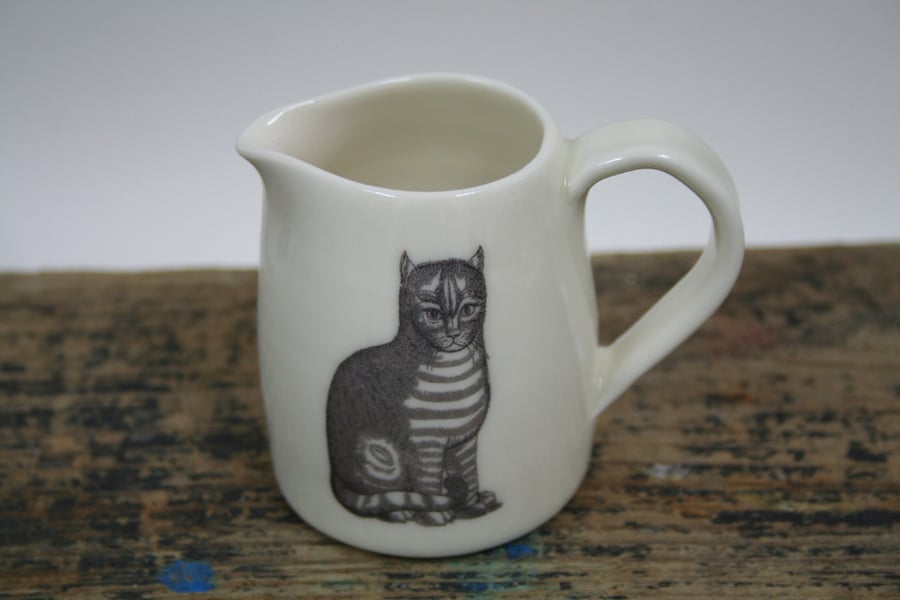 Porcelain jug with two cat images