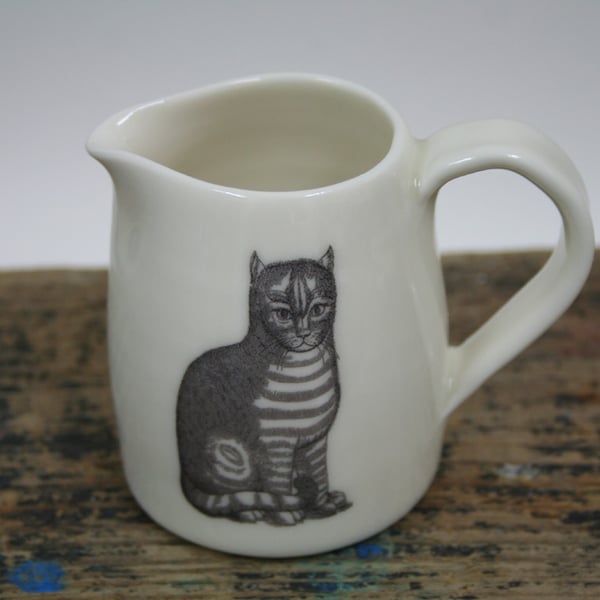 Porcelain jug with two cat images