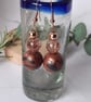 Conker brown and black dangly earrings with a bronze sheen - Image 1