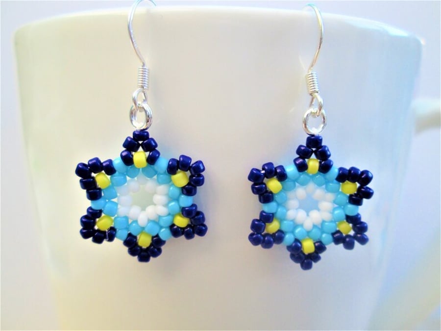 Blue Huichol inspired star flower beaded dangle earrings