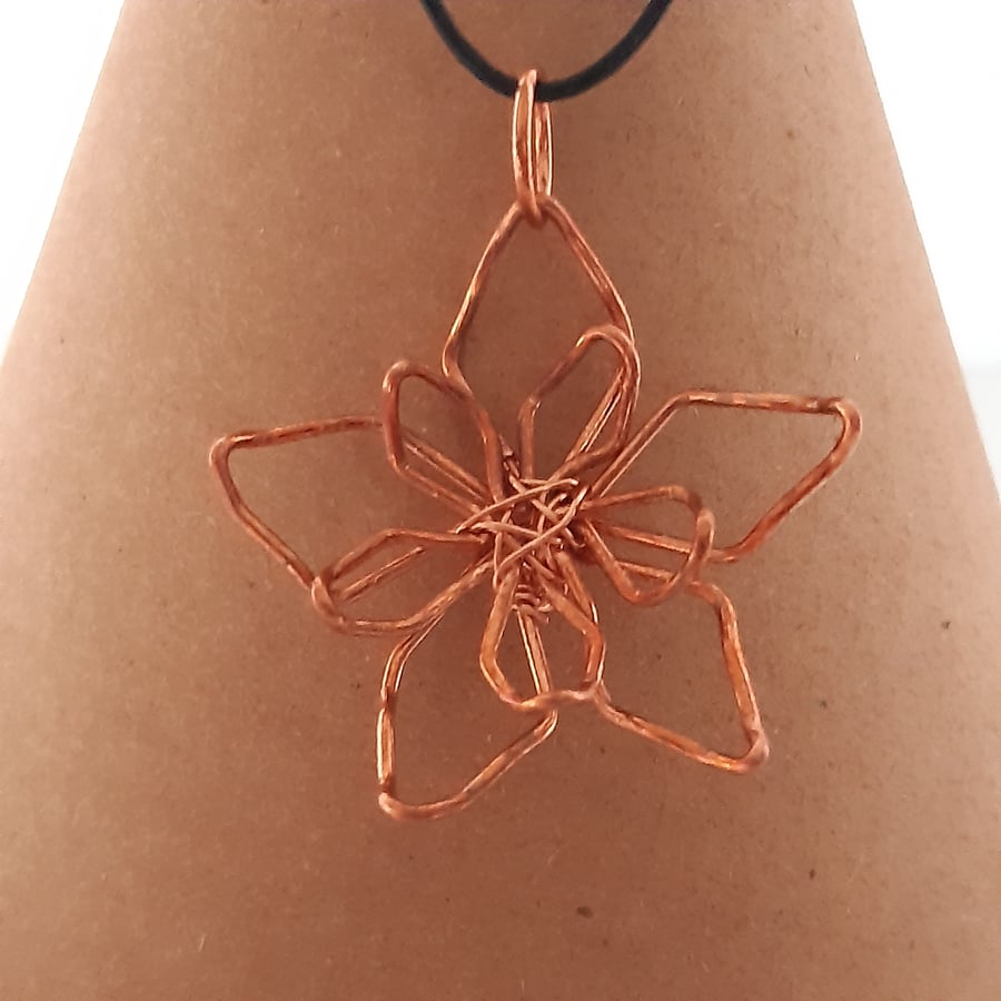 Copper flower shaped pendant