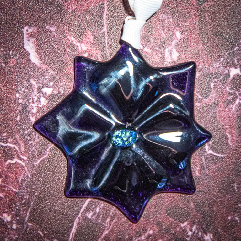 Star shaped light catcher in solid purple fused glass