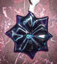 Star shaped light catcher in solid purple fused glass