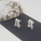 Cruces by Fedha - irregular, hashtag-shaped sterling silver stud earrings 