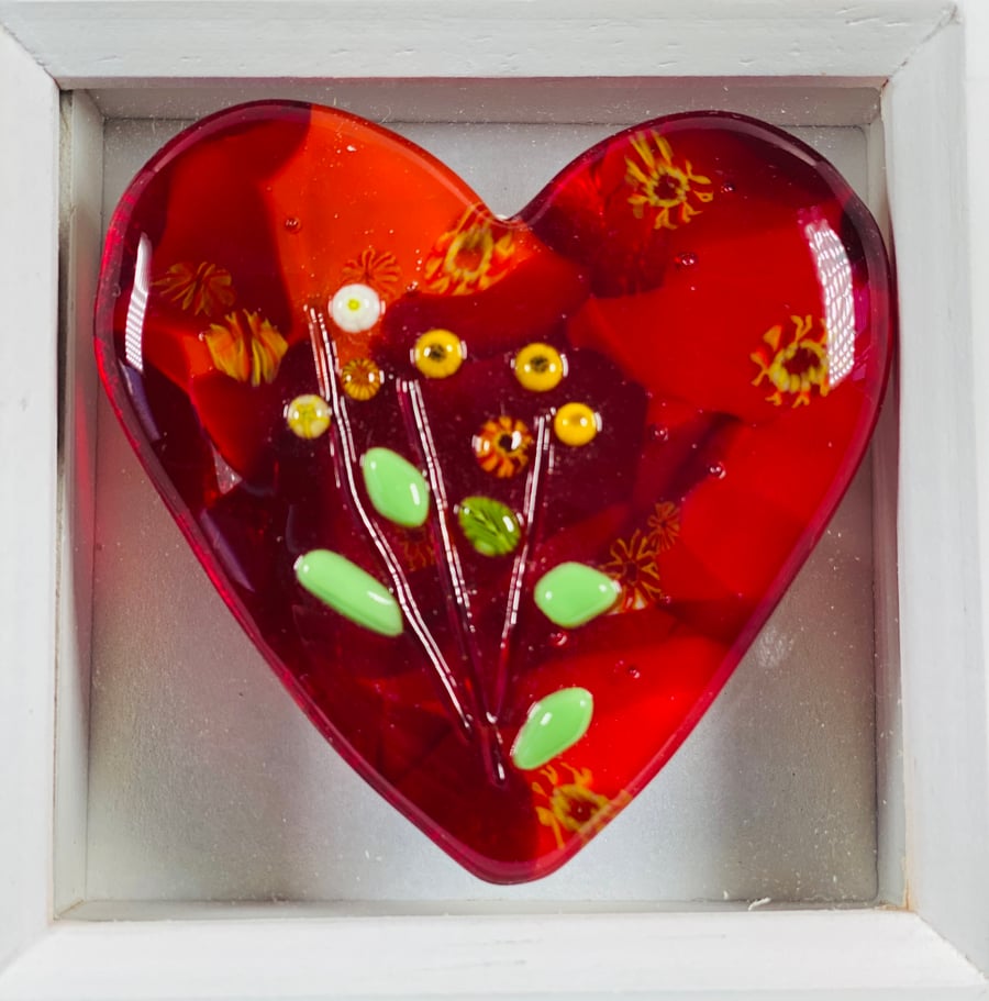 Fused glass heart with tiny flower detail I. A box frame 
