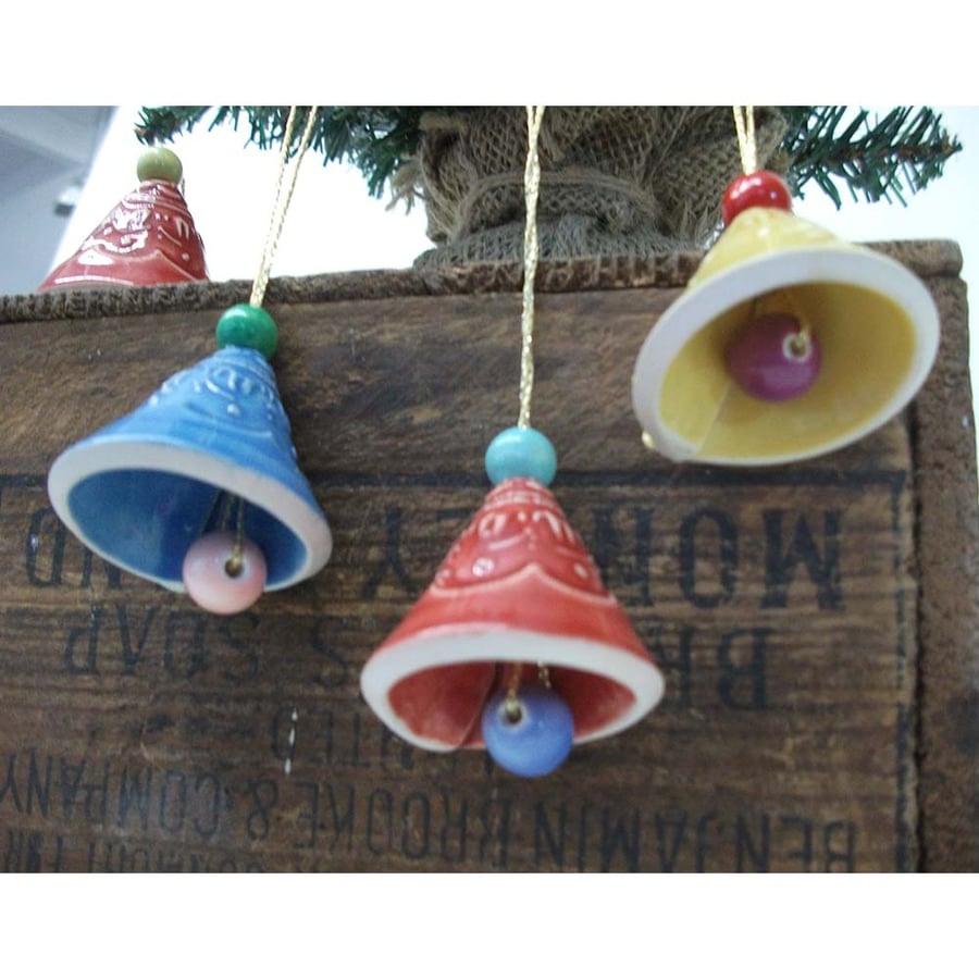 Set of four little pottery Christmas tree Bell decorations