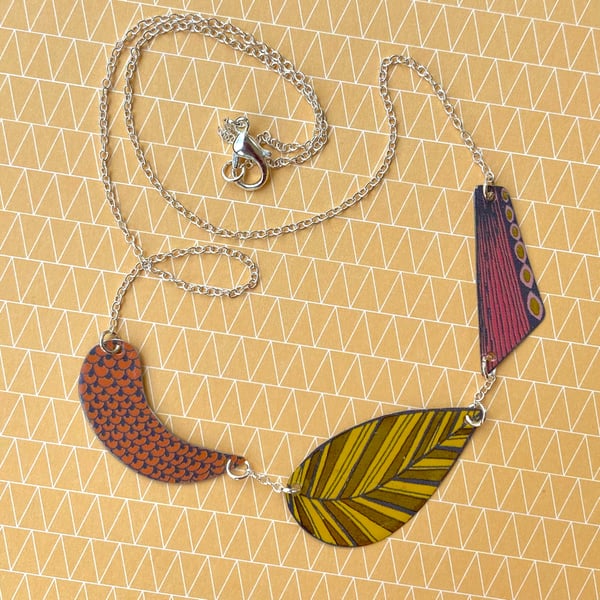 Recycled tin yellow, orange and pink three shape necklace