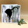 Blank Greetings Card' Black cat walking on ice with goldfish out of reach. 