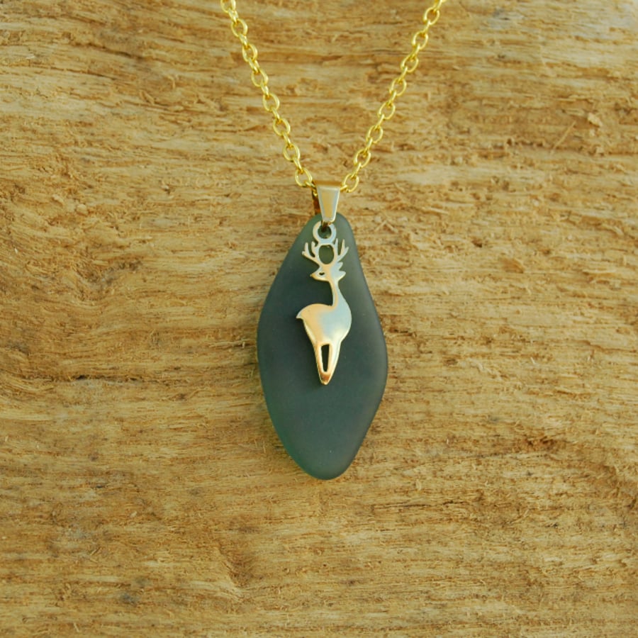 Dark aquamarine beach glass pendant with golden deer