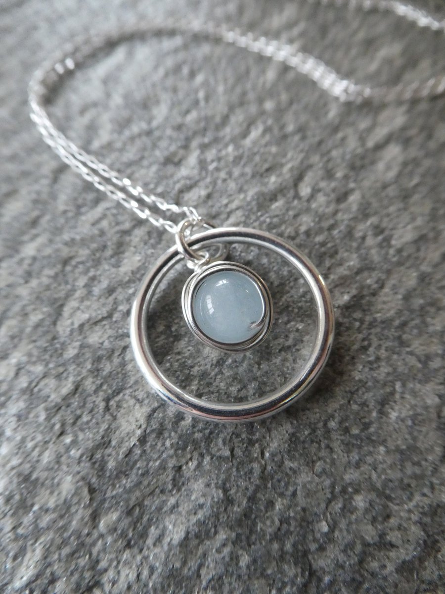 Sterling silver and aquamarine pendant, silver circle March birthstone necklace