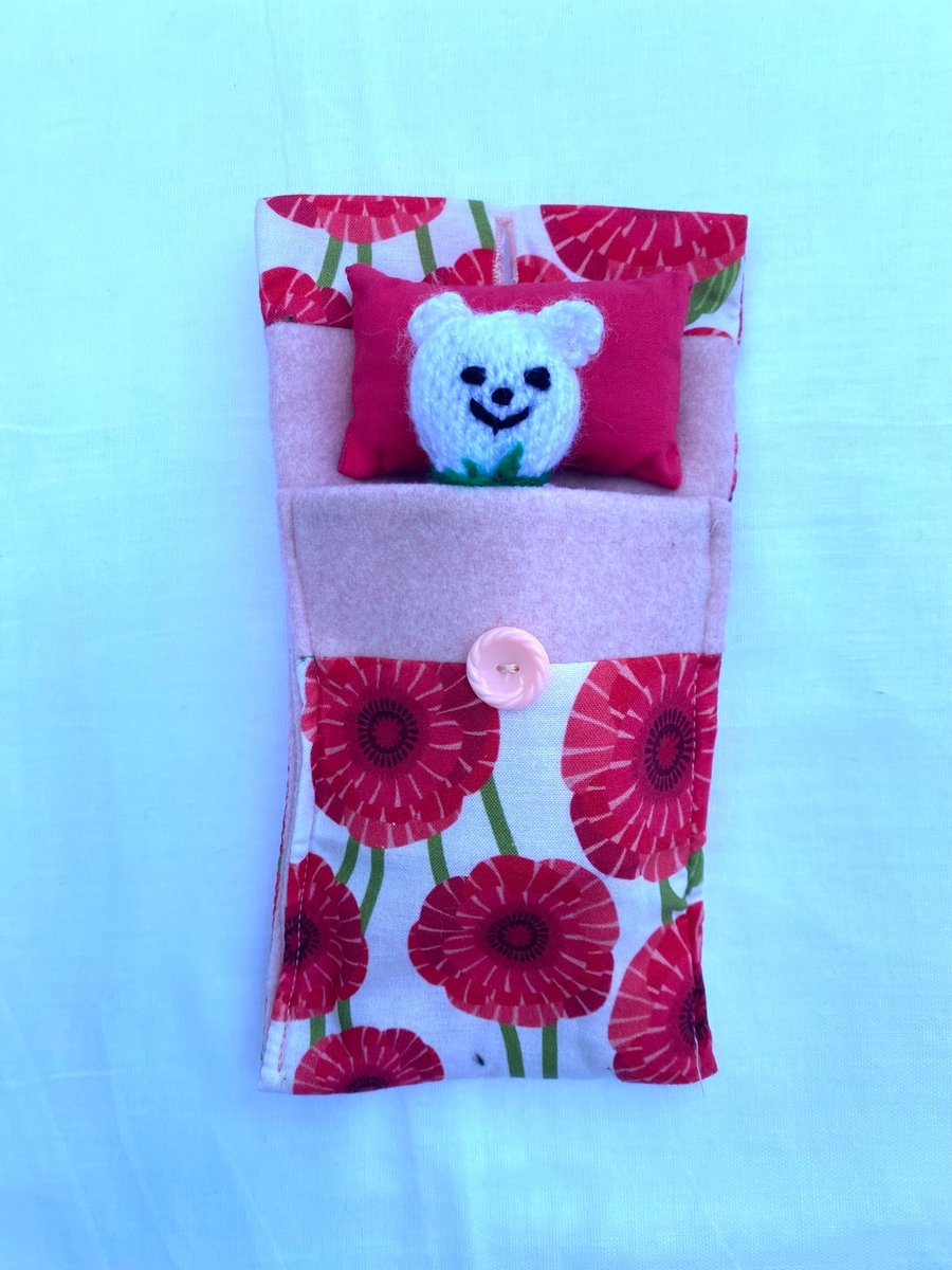Cute hand knitted mini bear in a purse