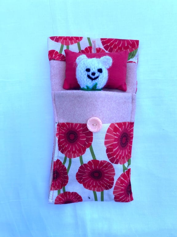 Cute hand knitted mini bear in a purse